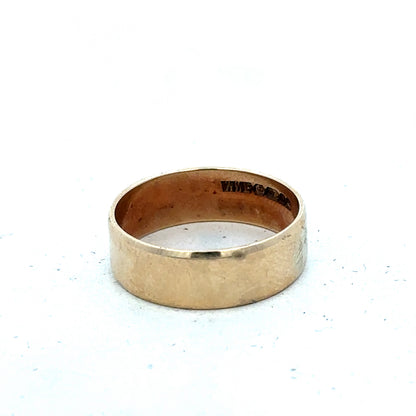 9ct yellow gold band ring in size P1/2 with a smooth polished finish, crafted by Reeves and Sons.