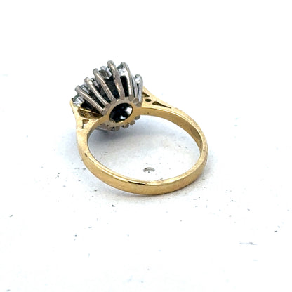 18ct yellow gold diamond and sapphire ring with a size H, featuring a detailed design by Reeves and Sons.