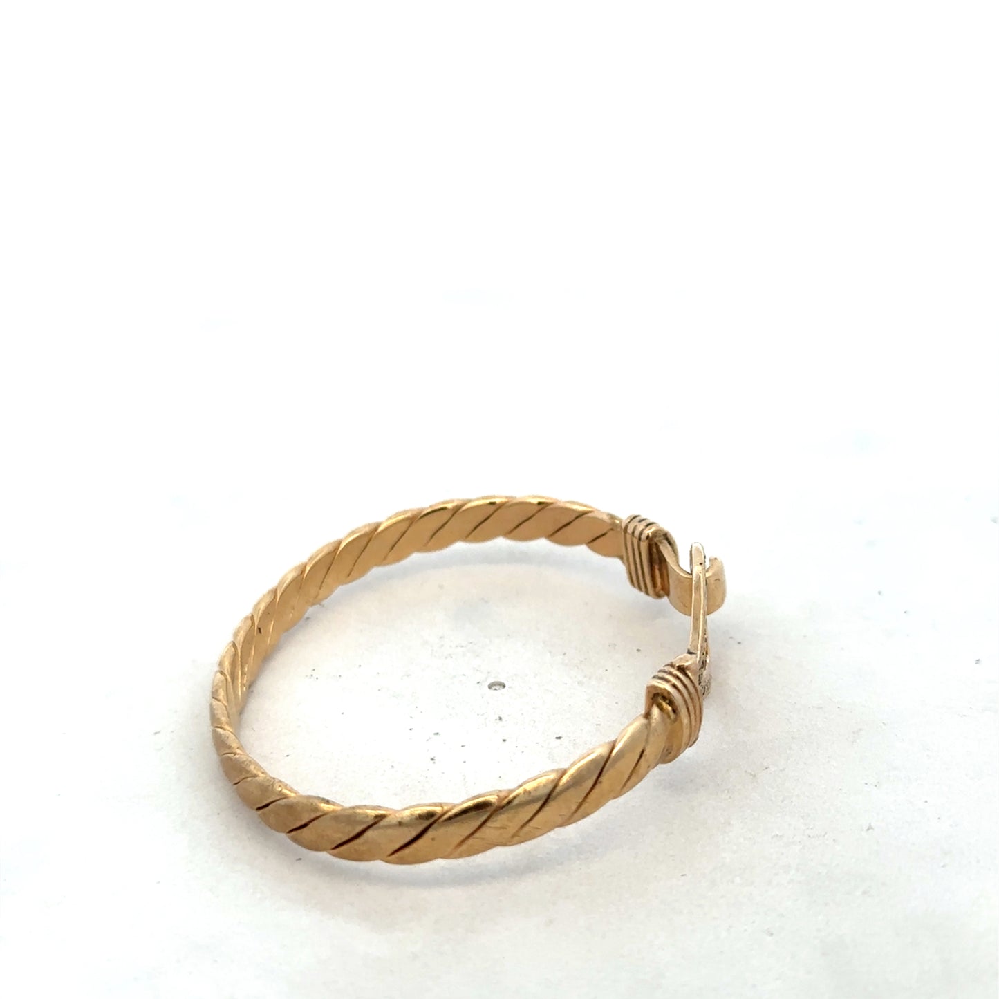 9ct yellow gold bracelet by Reeves and Sons, 12.7g, featuring a sleek bangle design with a polished finish.