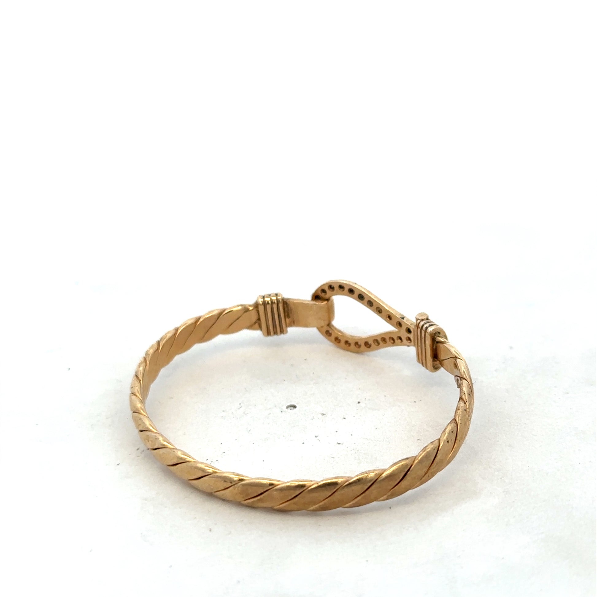 9ct yellow gold bangle bracelet with Reeves and Sons branding, weighing 12.7g, shown on a neutral background.