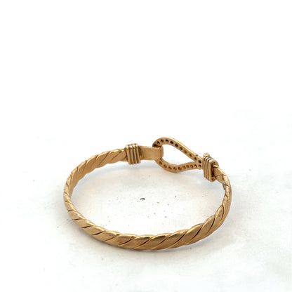 9ct yellow gold bangle bracelet with Reeves and Sons branding, weighing 12.7g, shown on a neutral background.