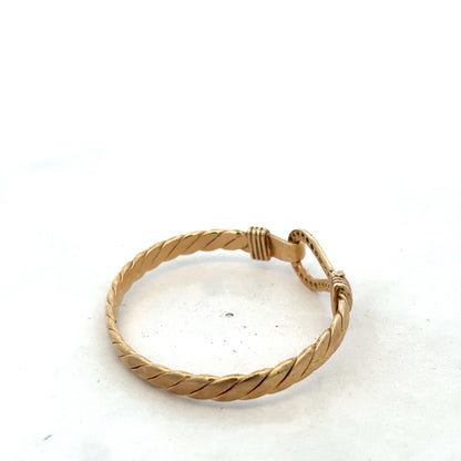 9ct yellow gold bangle bracelet weighing 12.7g by Reeves and Sons, smooth and polished jewelry accessory.