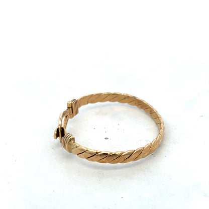 9ct yellow gold bracelet by Reeves and Sons, stylish bangle weighing 12.7g, with a smooth polished finish.