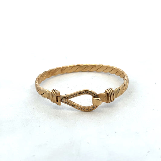 9ct yellow gold bangle bracelet weighing 12.7g from Reeves and Sons, featuring a smooth, polished finish and classic design.