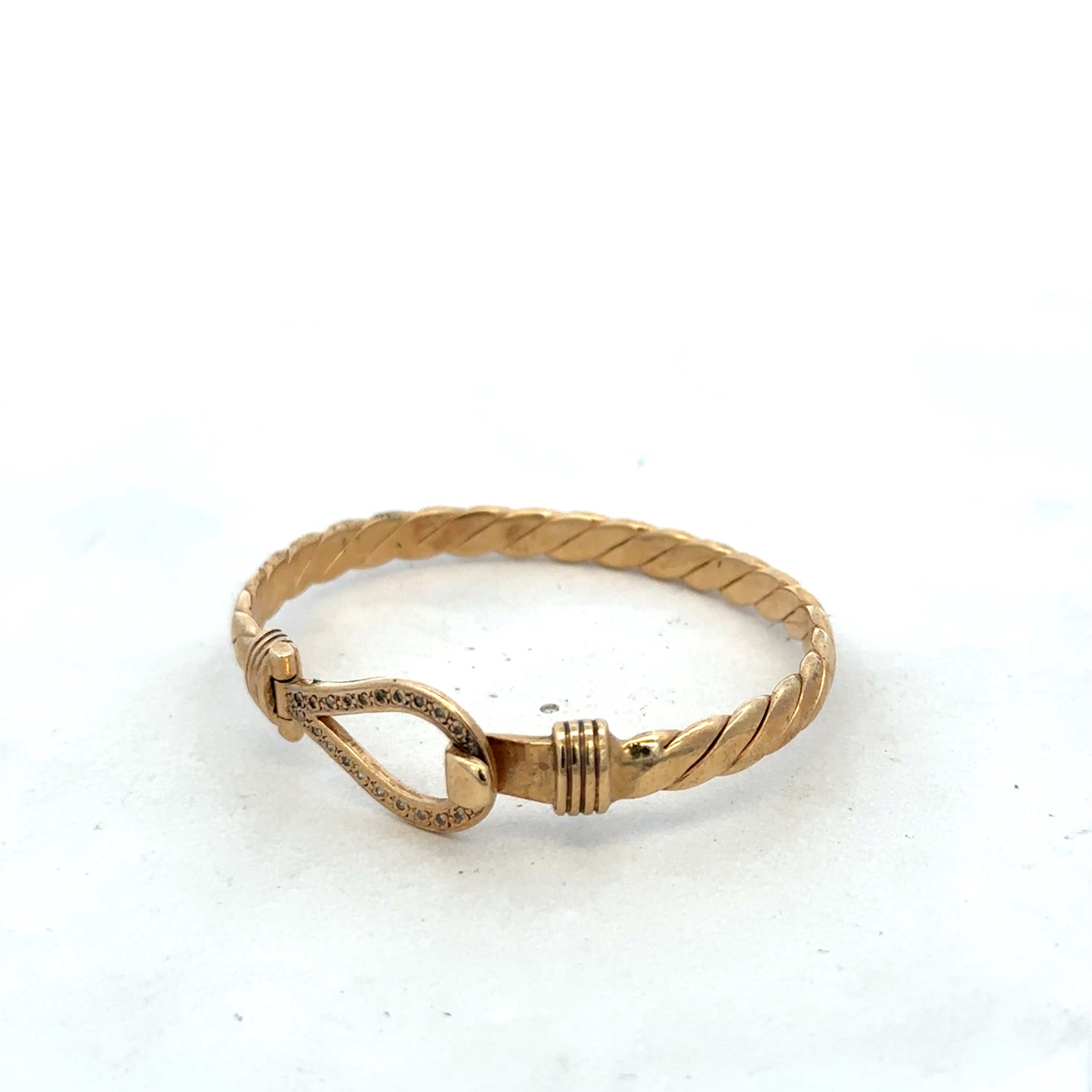 9ct yellow gold bracelet bangle by Reeves and Sons, featuring a smooth, polished finish and a lightweight design.