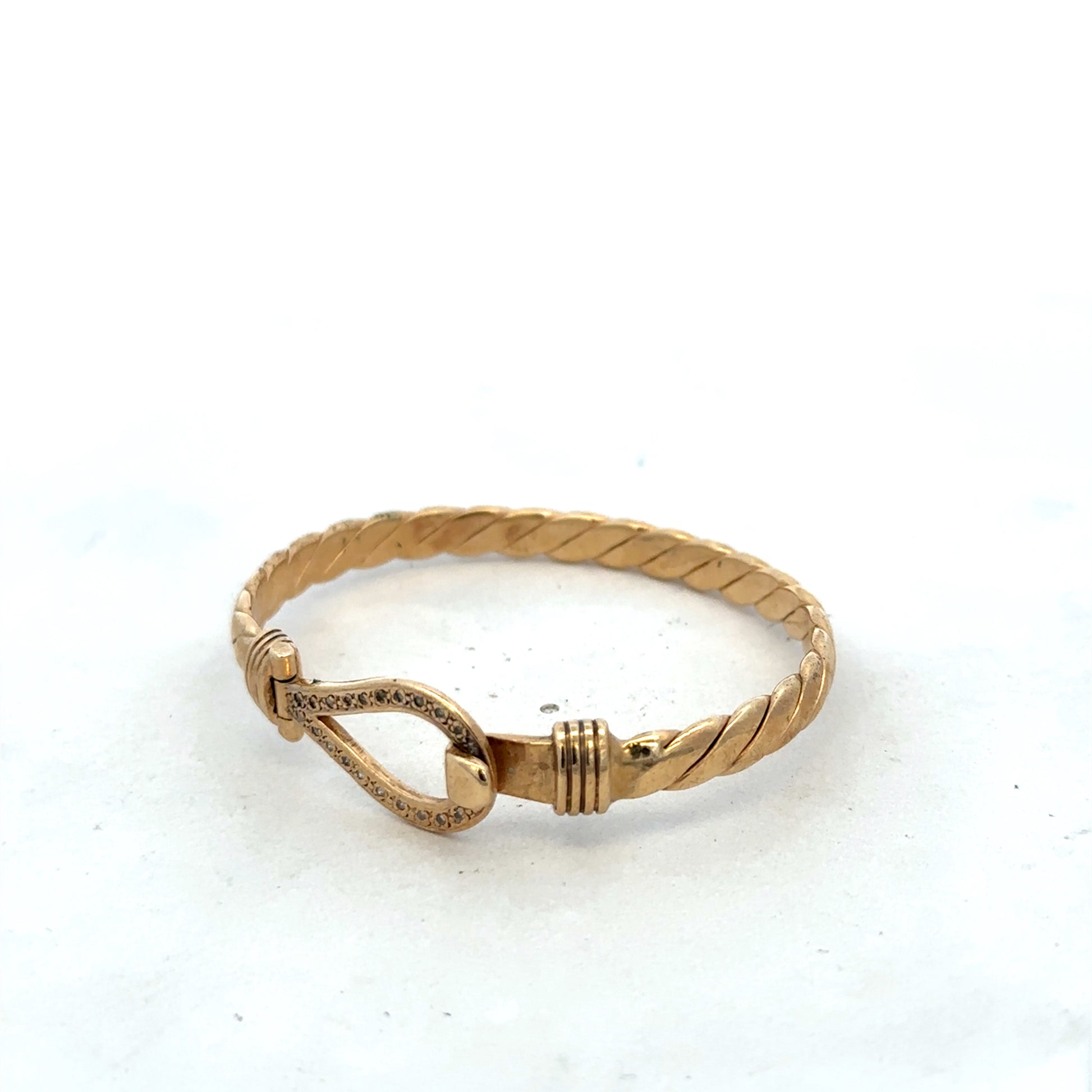9ct yellow gold bracelet bangle by Reeves and Sons, featuring a smooth, polished finish and a lightweight design.