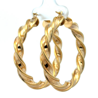 9ct yellow gold hoop earrings weighing 4.6g, featuring a classic circular design by Reeves and Sons.