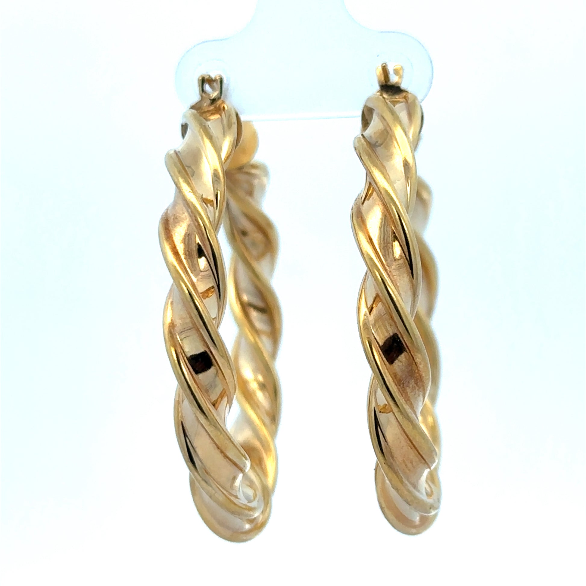 9ct yellow gold hoop earrings weighing 4.6g, showcasing shiny, classic round design with Reeves and Sons branding.
