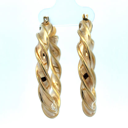 9ct yellow gold hoop earrings weighing 4.6g, showcasing shiny, classic round design with Reeves and Sons branding.