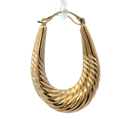 9ct yellow gold hoop earrings weighing 3.4g, featuring a classic circular design, from Reeves and Sons.