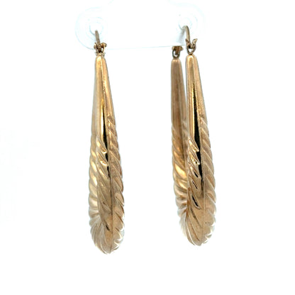 9ct yellow gold hoop earrings weighing 3.4g, stylish and classic jewelry by Reeves and Sons, shown in the image.