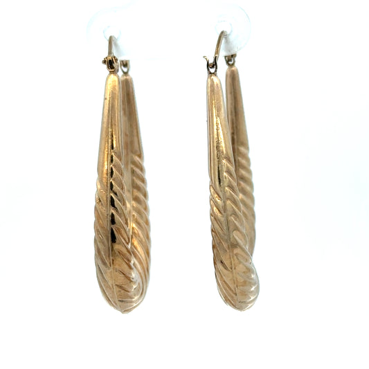 9ct yellow gold hoop earrings weighing 3.4g, stylish and polished, designed by Reeves and Sons.