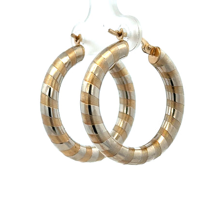 9ct yellow gold hoop earrings weighing 3.6g, stylish and shiny, featuring smooth circular design, by Reeves and Sons.