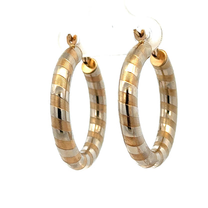 9ct yellow gold hoop earrings weighing 3.6g, stylish and classic jewelry by Reeves and Sons, shown in close-up image.