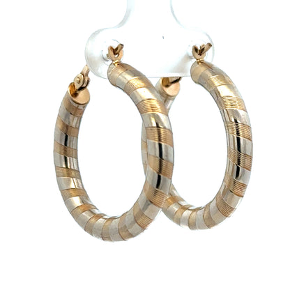 9ct yellow gold hoop earrings with a 3.6g weight from Reeves and Sons, showcasing their smooth, polished finish.