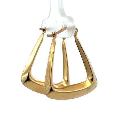 9ct yellow gold hoop earrings by Reeves and Sons, 2.1g, showcasing smooth, polished circular earrings on a plain background.