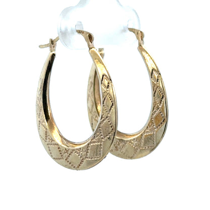 9ct yellow gold hoop earrings weighing 0.6g, featuring a classic round design, from Reeves and Sons.