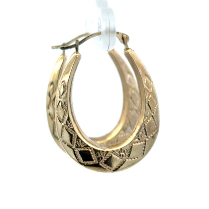 9ct yellow gold hoop earrings weighing 0.6g by Reeves and Sons, close-up view of classic small gold hoop earrings.