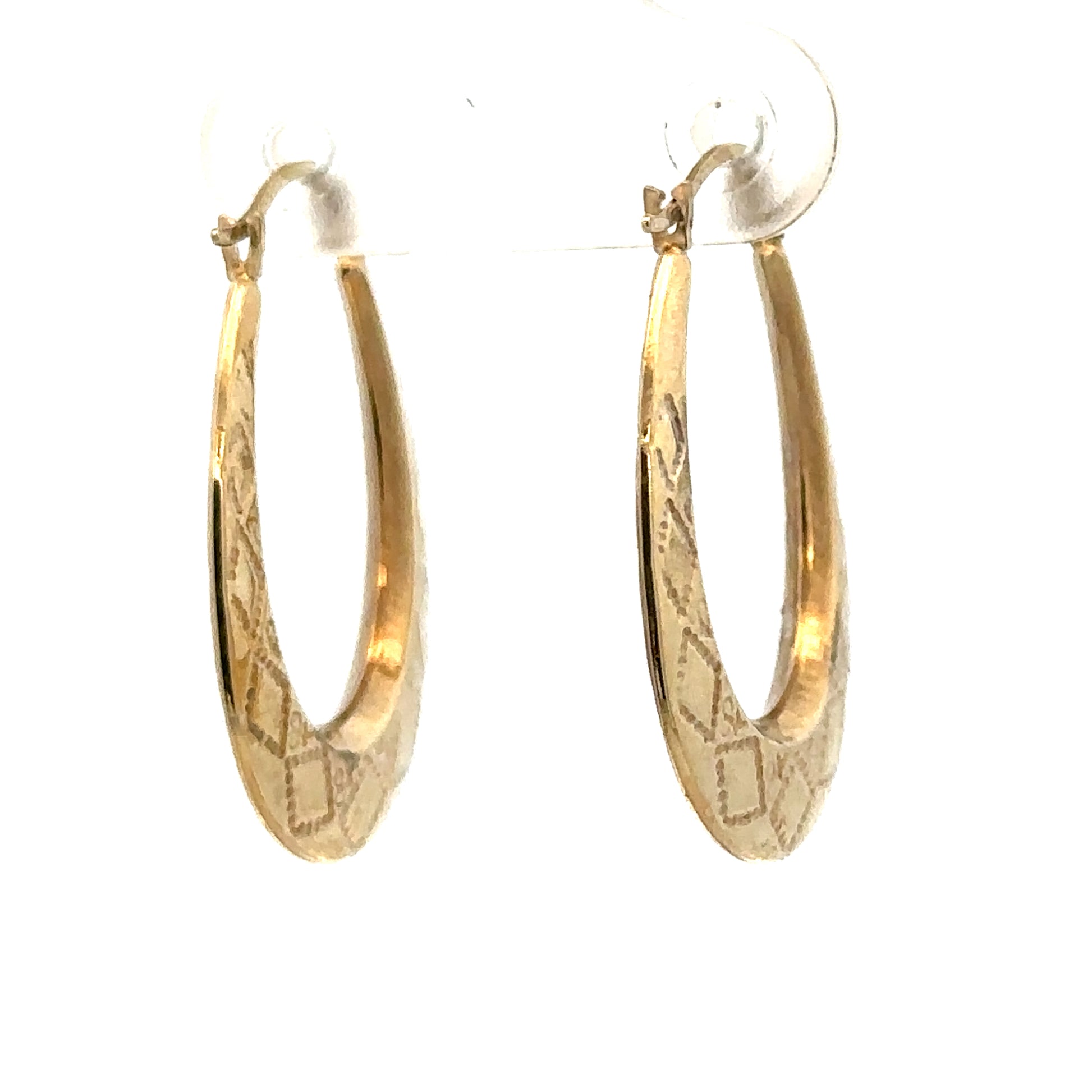 9ct yellow gold hoop earrings weighing 0.6g, stylish and lightweight jewelry by Reeves and Sons, shown in a close-up image.
