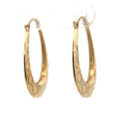 9ct yellow gold hoop earrings weighing 0.6g, stylish and lightweight jewelry by Reeves and Sons, shown in a close-up image.