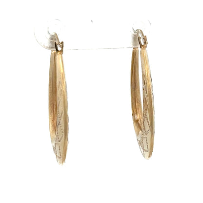 9ct yellow gold hoop earrings by Reeves and Sons, lightweight 0.6g, shown in a close-up image.