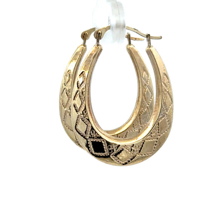 Reeves and Sons 9ct yellow gold hoop earrings, lightweight 0.6g, with a classic circular design and polished finish.