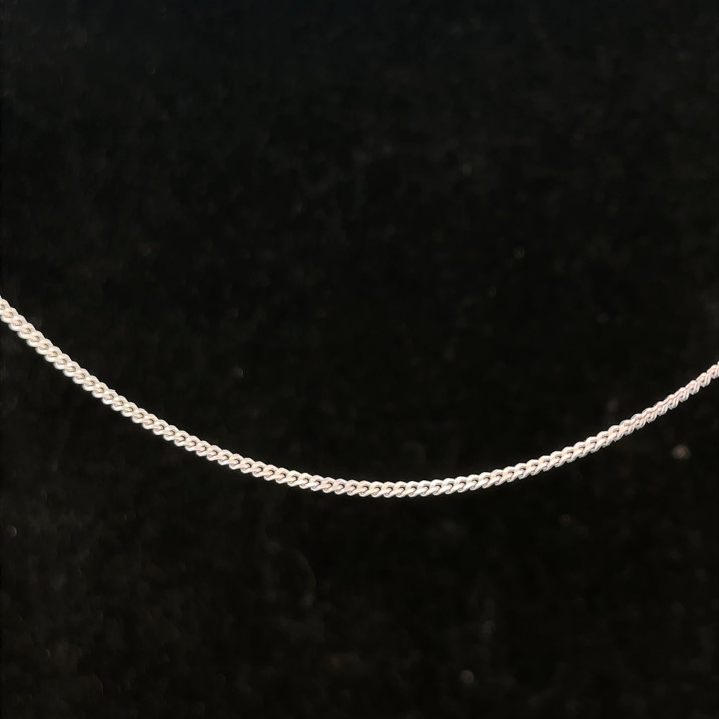9ct white gold chain weighing 2.9g with a delicate link design, by Reeves and Sons, shown in the image.