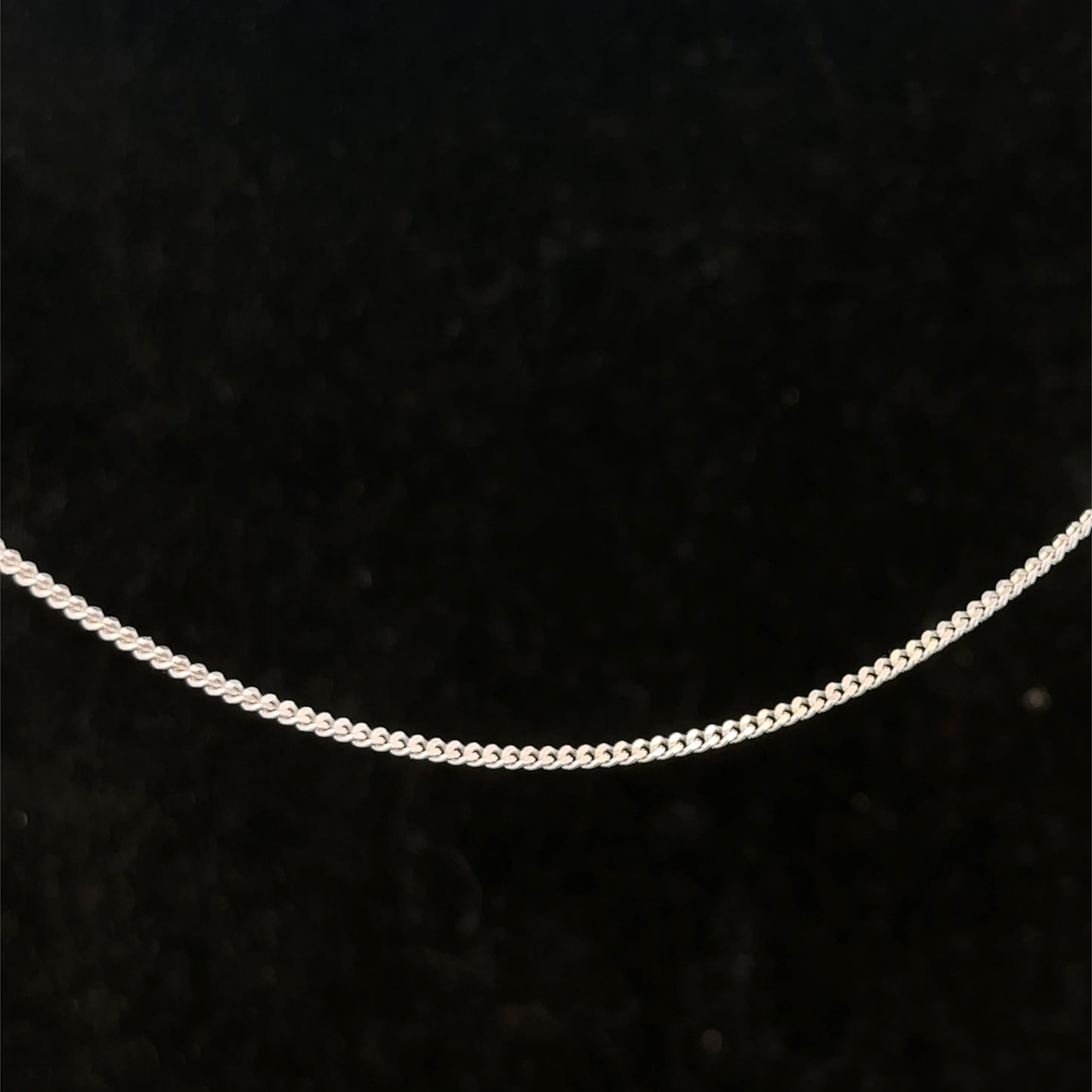 9ct white gold chain weighing 2.9g from Reeves and Sons, showcasing a delicate, polished jewelry chain.