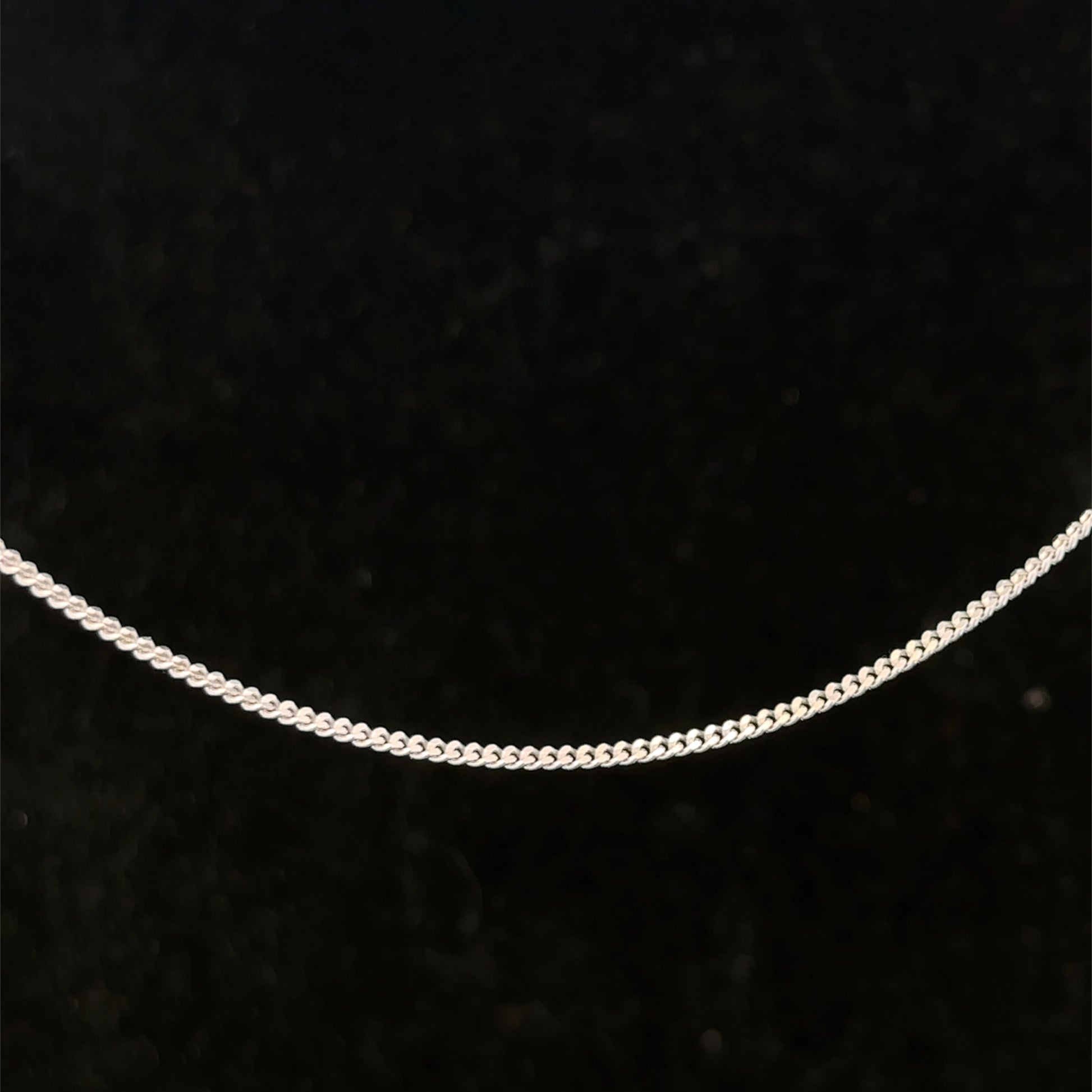 9ct white gold chain weighing 2.9g from Reeves and Sons, showcasing a delicate, polished jewelry chain.