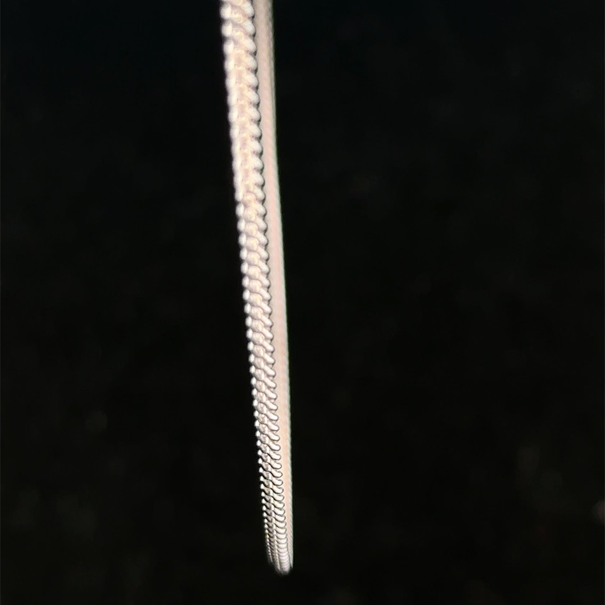 9ct white gold chain weighing 2.9g, featuring a classic link design, from Reeves and Sons.