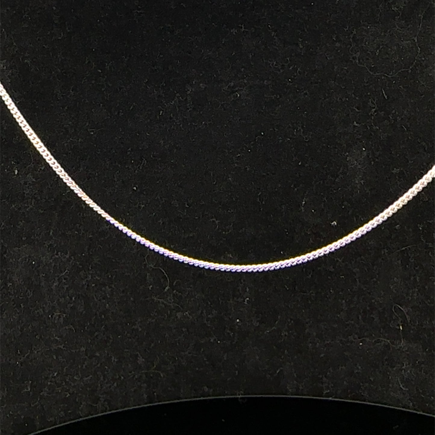 9ct white gold chain weighing 2.9g, showcasing a delicate and polished Reeves and Sons jewelry chain on a neutral background.