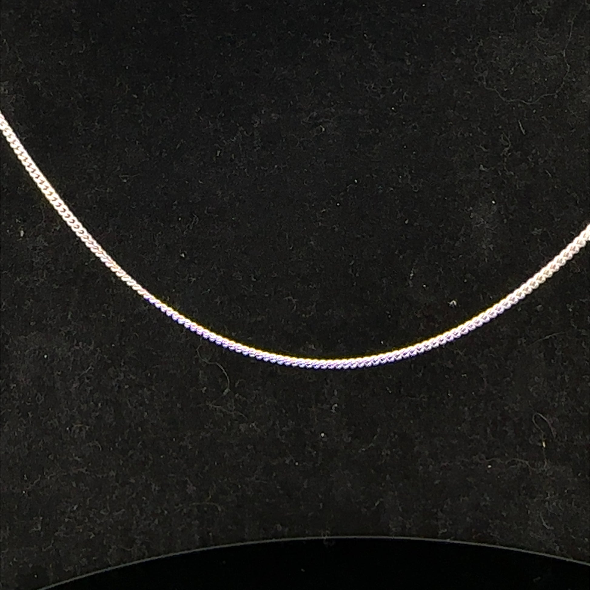 9ct white gold chain weighing 2.9g, showcasing a delicate and polished Reeves and Sons jewelry chain on a neutral background.