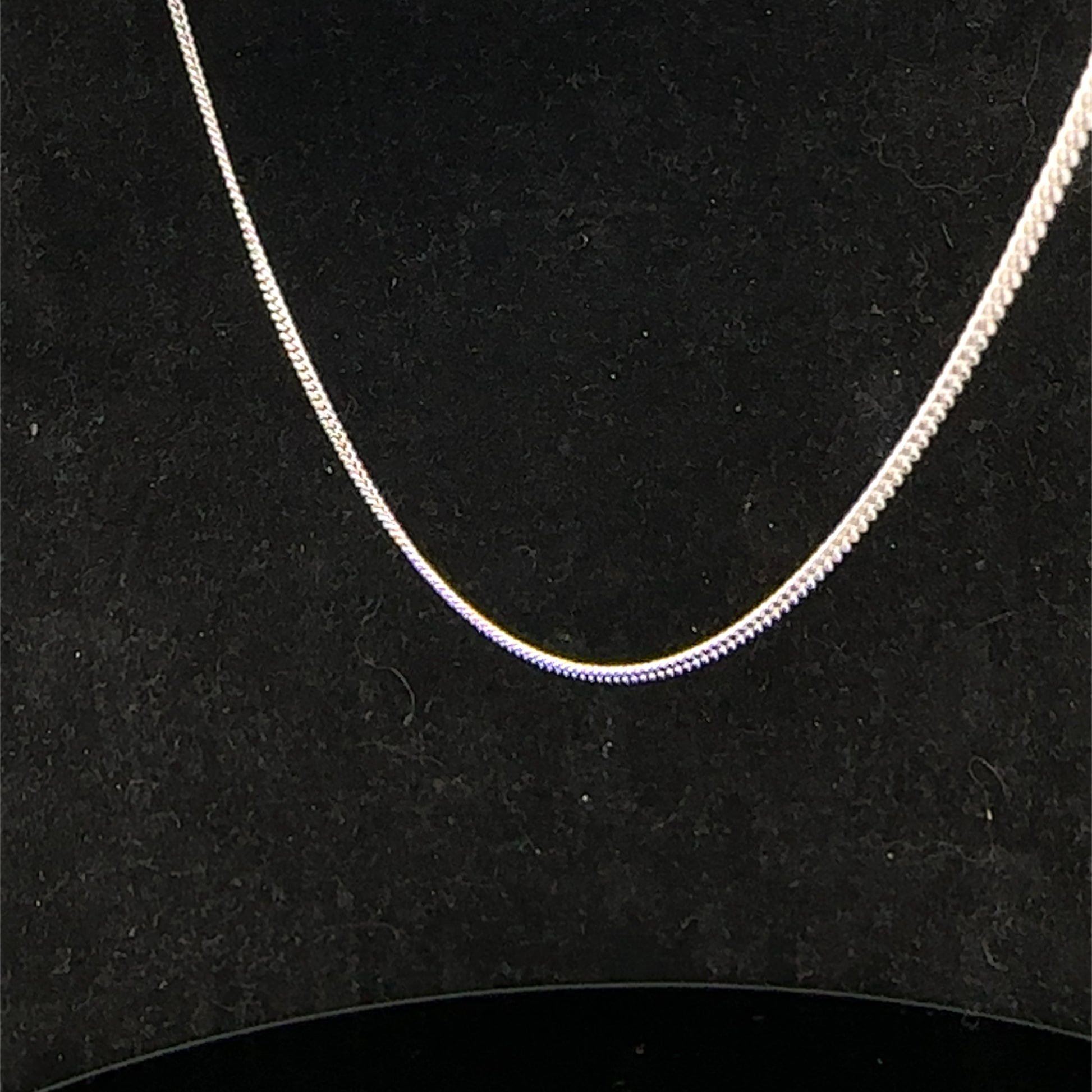 9ct white gold chain weighing 2.9g, elegant jewelry piece from Reeves and Sons, featuring a delicate link design.