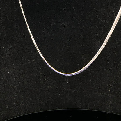 9ct white gold chain weighing 2.9g, elegant jewelry piece from Reeves and Sons, featuring a delicate link design.