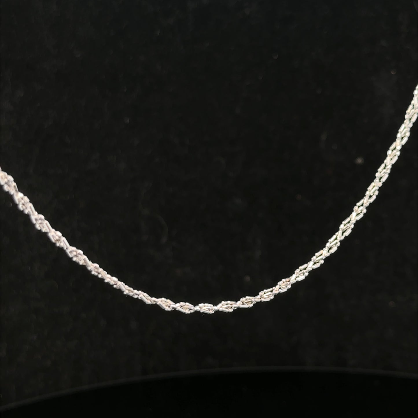 9ct white gold chain weighing 3.2g, featuring a delicate link design, by Reeves and Sons, shown in the product image.