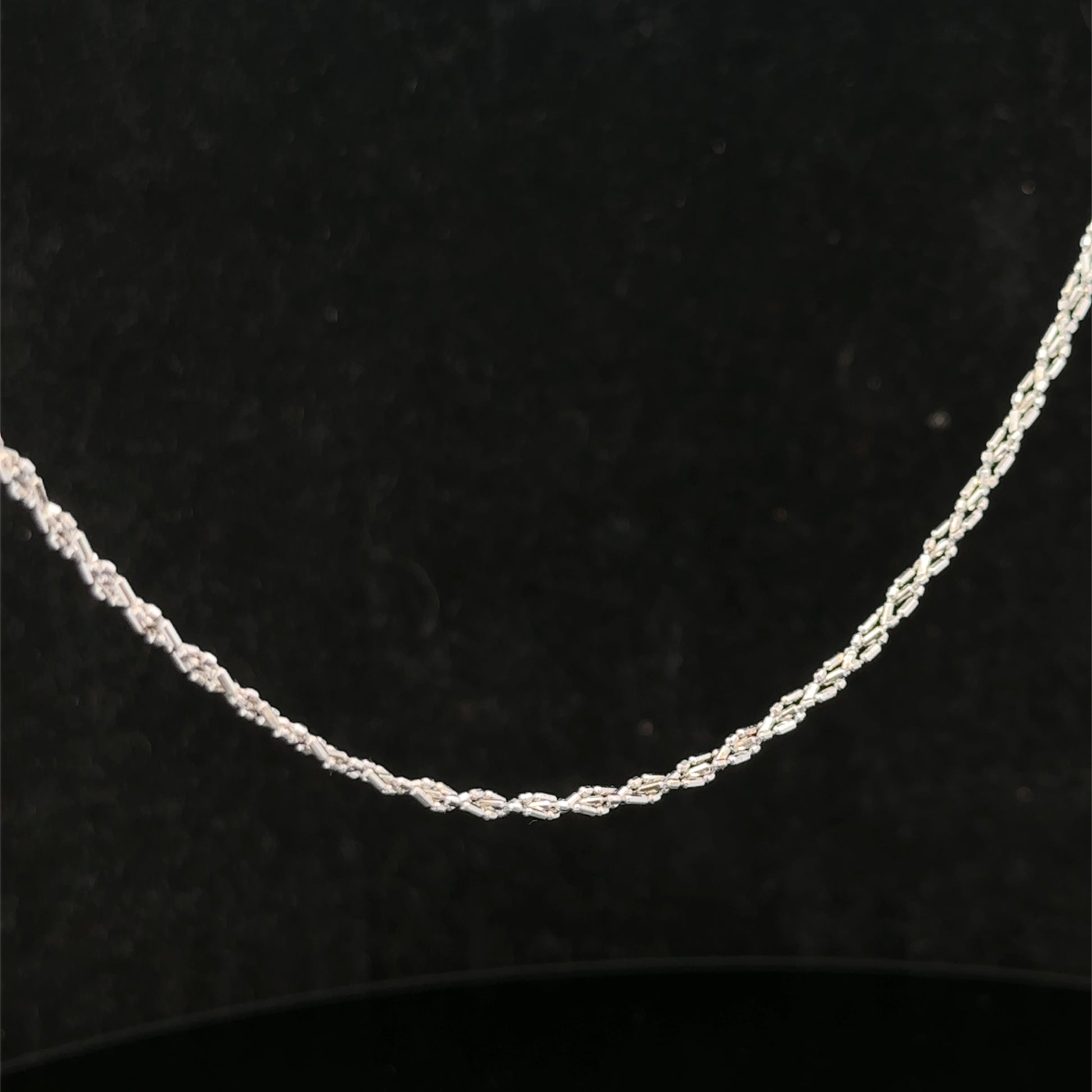 9ct white gold chain weighing 3.2g, featuring a delicate link design, by Reeves and Sons, shown in the product image.