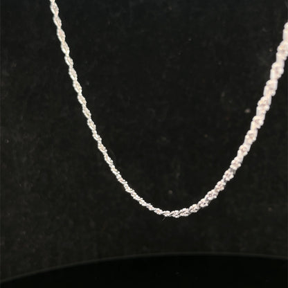 Reeves and Sons 9ct white gold chain weighing 3.2g, featuring a delicate link design, shown in a close-up image.