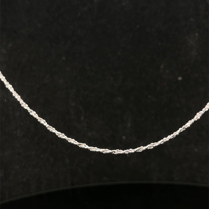 9ct white gold chain weighing 3.2g, sleek and elegant Reeves and Sons jewelry, displayed on a plain background.