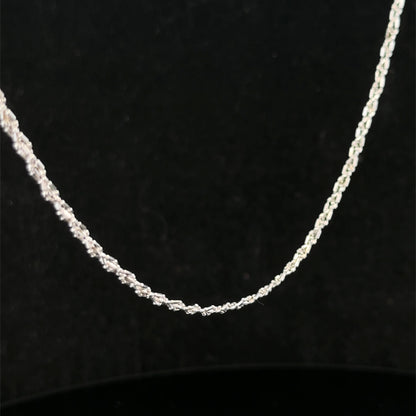 9ct white gold chain weighing 3.2g, from Reeves and Sons, shown in a close-up image highlighting its fine craftsmanship.