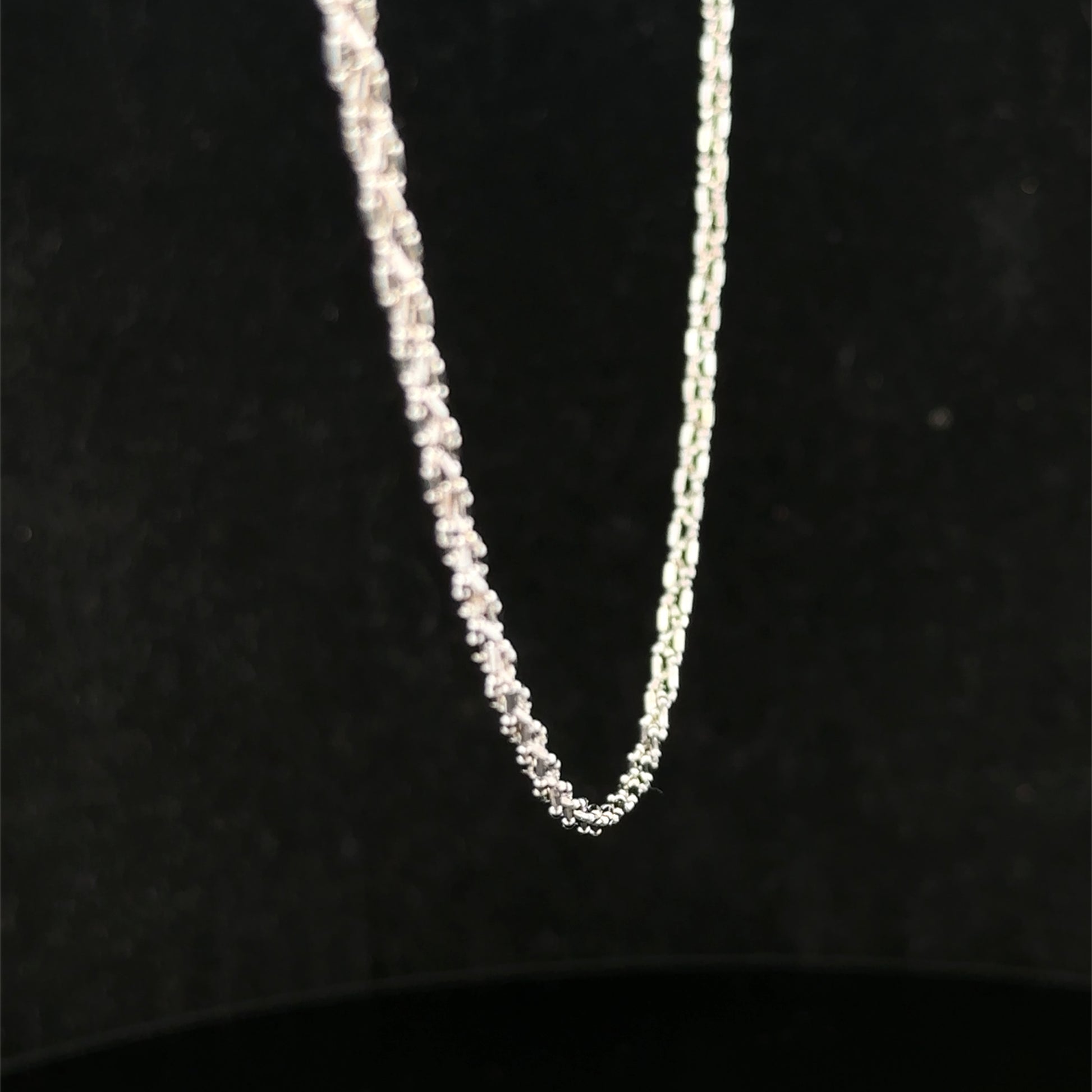 9ct white gold chain weighing 3.2g, featuring a delicate link design from Reeves and Sons.
