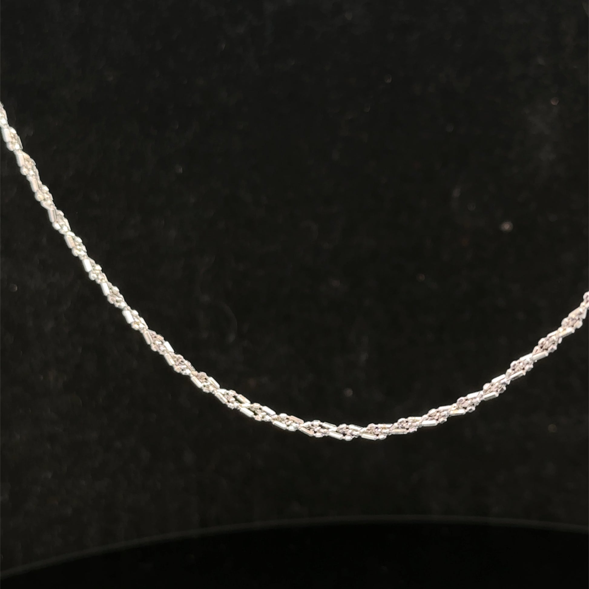 9ct white gold chain weighing 3.2g from Reeves and Sons, showcasing a delicate and polished jewelry chain.
