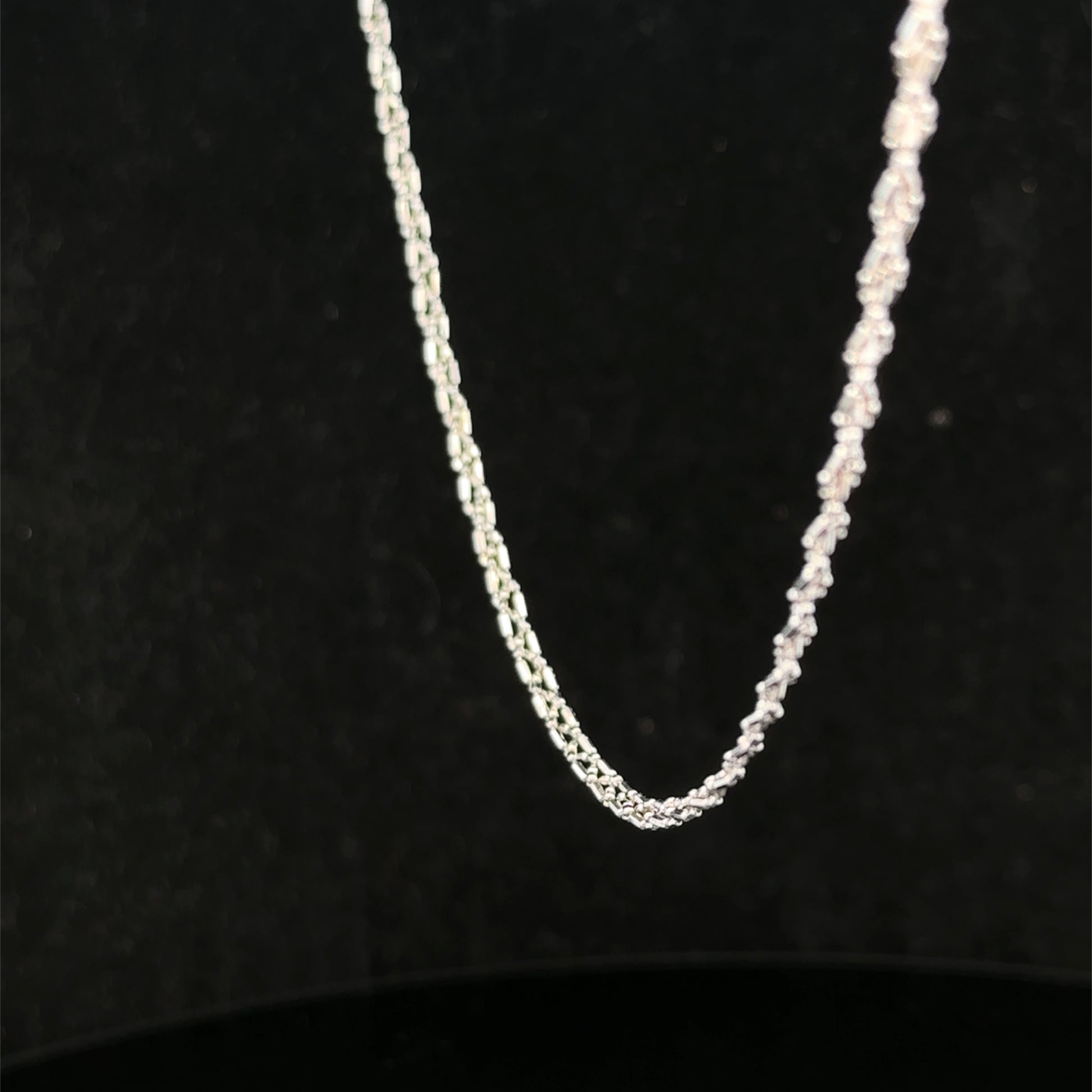 9ct white gold chain weighing 3.2g, Reeves and Sons, displayed on a neutral background showing its fine link design.