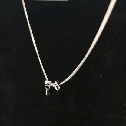 9ct white gold chain weighing 2.7g, Reeves and Sons, with detailed link design, shown in close-up image.