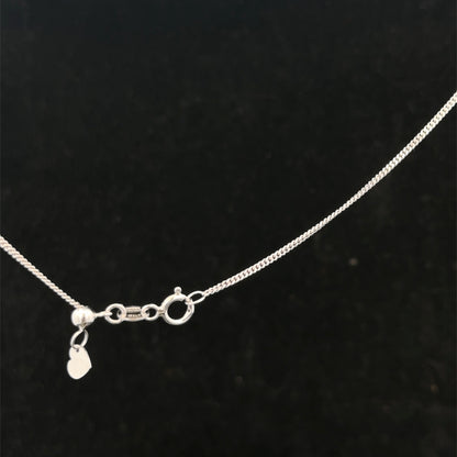 9ct white gold chain weighing 2.7g with a polished finish, featuring a classic link design by Reeves and Sons.