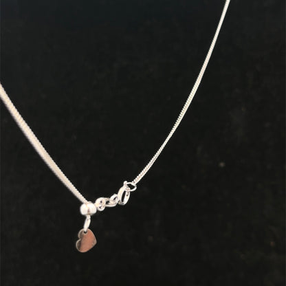 9ct white gold chain weighing 2.7g, displayed on a plain background, showcasing its elegant link design from Reeves and Sons.