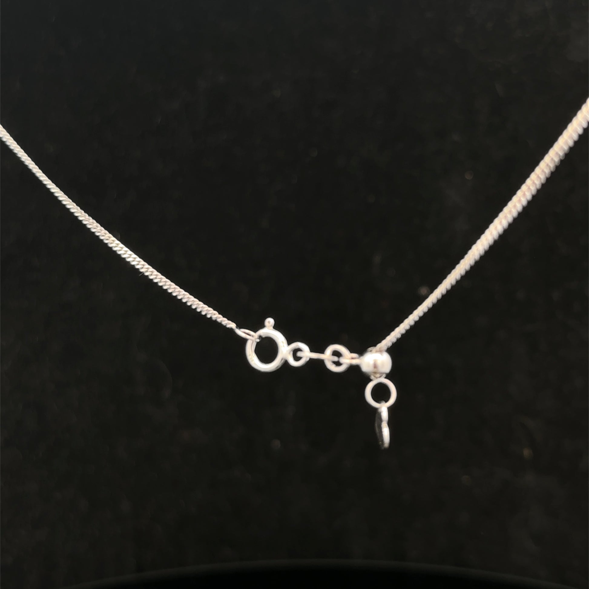 9ct white gold chain weighing 2.7g, crafted by Reeves and Sons, showcasing a delicate and polished jewelry chain.