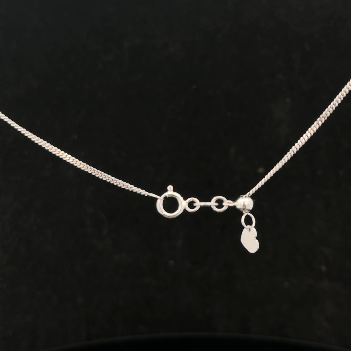 9ct white gold chain weighing 2.7g, featuring a delicate link design, from Reeves and Sons.