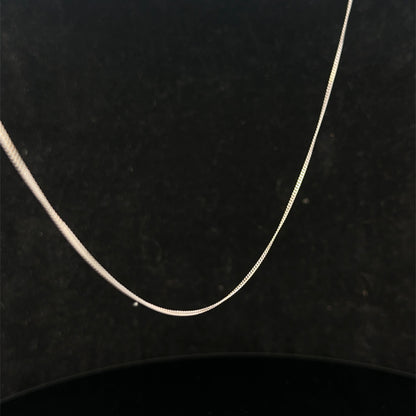 9ct white gold chain by Reeves and Sons, lightweight and elegant jewelry chain, 1.5g in weight, shown in close-up detail.