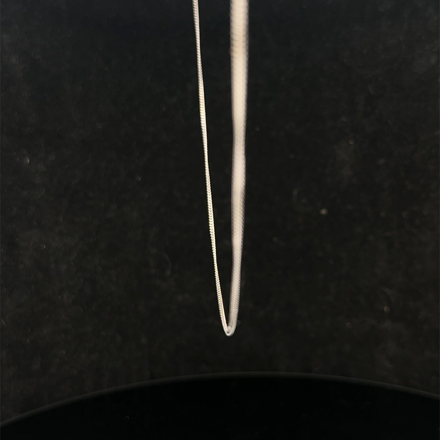 9ct white gold chain weighing 1.5g featuring a delicate link design, crafted by Reeves and Sons.