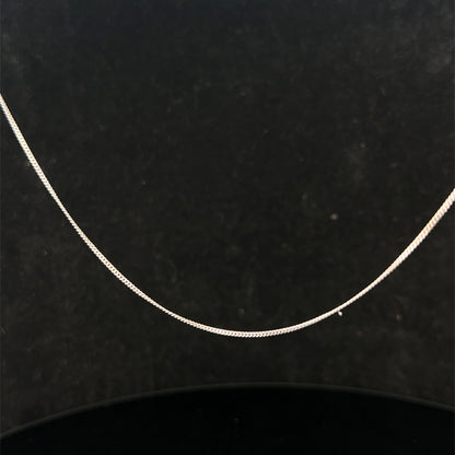 9ct white gold chain weighing 1.5g with a delicate link design, crafted by Reeves and Sons.